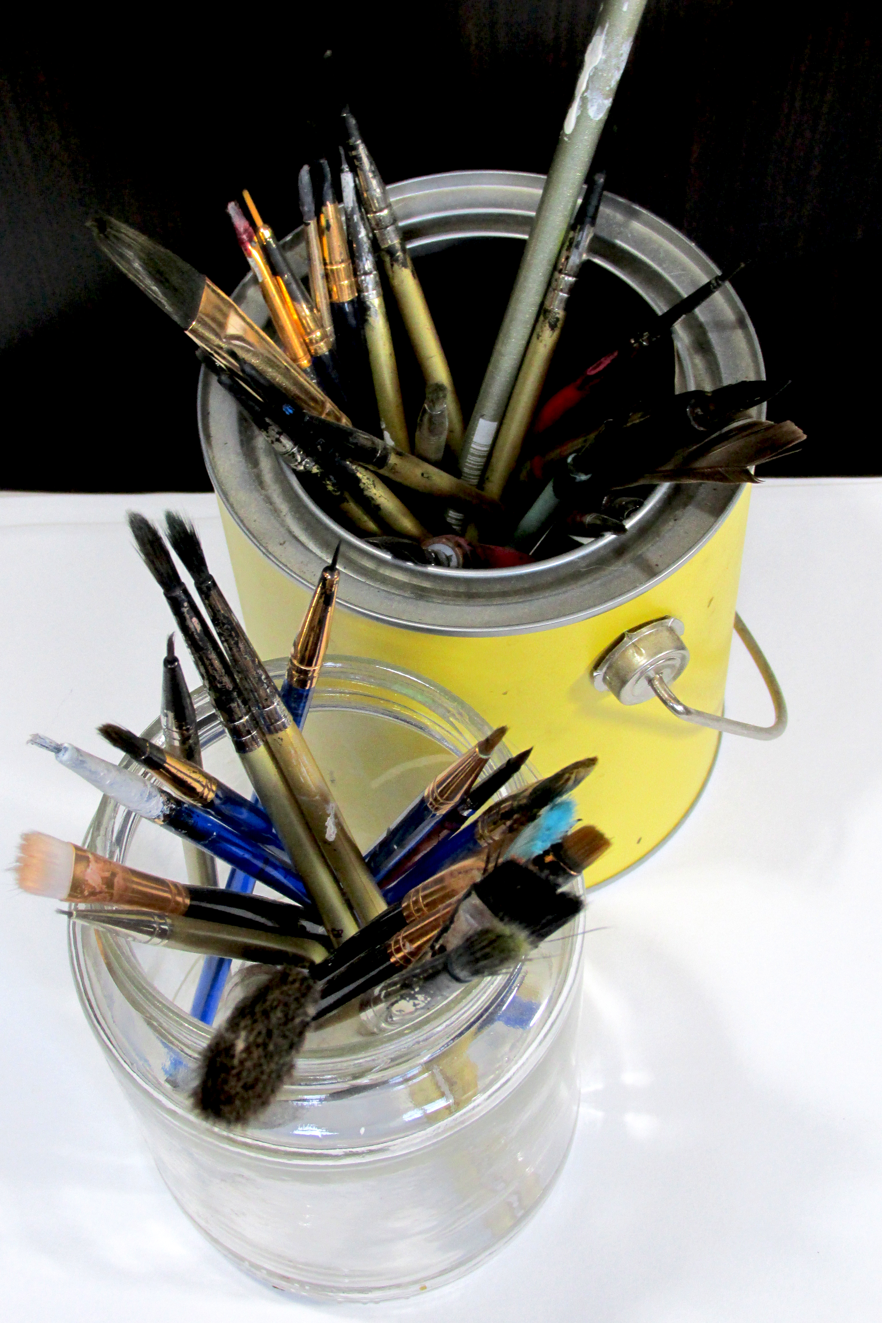 Brushes in a tin yellow bucket